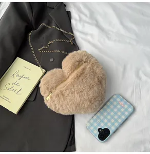 Plush heart-shaped crossbody bag with gold chain, cozy autumn winter shoulder bag aesthetic.