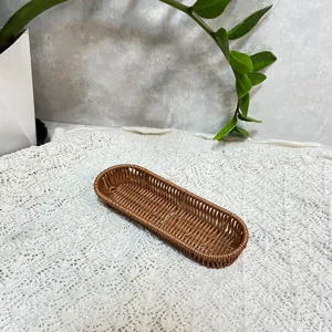 Detailed view of brown imitation rattan cutlery basket, perfect for kitchen tableware storage.