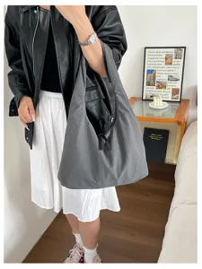 Large capacity grey shoulder bag, minimalist casual style, perfect for daily commute or travel.