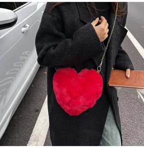 Red heart-shaped plush crossbody bag with chain strap, soft winter fashion shoulder bag.
