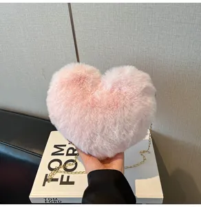 Pink plush heart crossbody bag with gold chain strap, cute autumn winter shoulder handbag.
