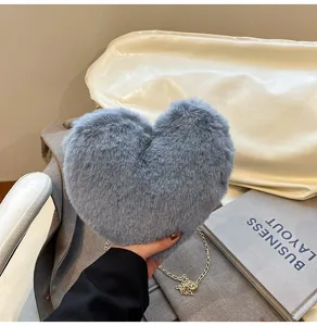 Grey plush heart crossbody bag for women, chic fuzzy shoulder purse with chain strap.