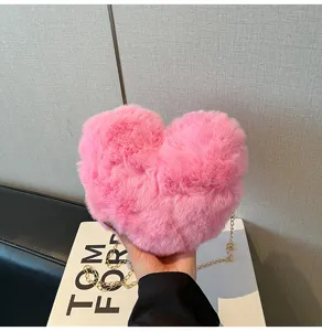 Pink faux fur heart-shaped crossbody bag with gold chain stylish niche design shoulder bag