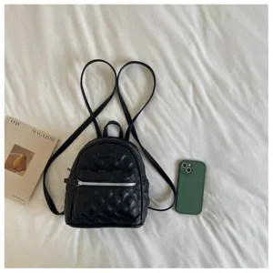 Mini sac à dos matelassé noir pour femme, sac de voyage élégant en cuir PU décontracté.