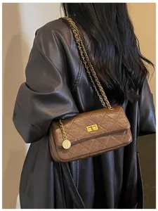 Classic brown quilted leather shoulder bag with gold chain strap and chic turn lock design.