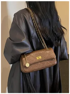 Brown quilted chain shoulder bag detail shot, classic design underarm bag for daily commute.