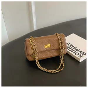 Brown quilted chain shoulder bag for women, chic faux leather crossbody bag for daily commute.