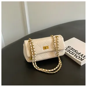 Chic white quilted leather shoulder bag featuring classic gold-tone turn-lock and chain strap.