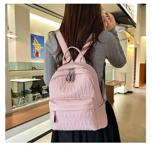 Pink quilted PU leather casual backpack for women, stylish daily school daypack with zip.
