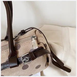 Chic polka dot shoulder bag, stylish retro design detail view for modern women daily commute.