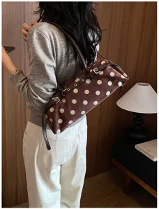 Korean style brown polka dot shoulder bag, chic baguette bag design with slim strap and metal buckle.