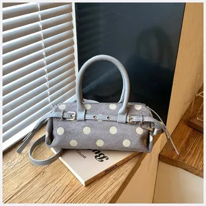Grey polka dot shoulder bag with belt detail, chic baguette bag for daily commuting.