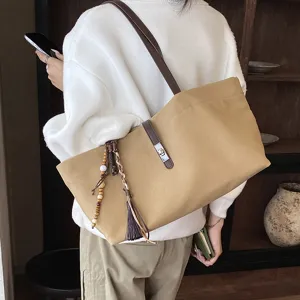 Casual canvas tote bag for women large capacity shoulder bag with stylish leather straps.