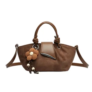 Brown suede women's shoulder bag with chic flower pendant, stylish casual daily handbag.
