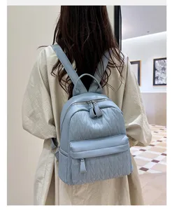 Casual leather backpack for women, stylish daily school bag with quilted design and ample storage.