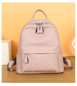 Pink PU leather casual backpack for women, stylish quilted design with large capacity daily use.