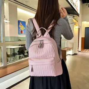 Pink quilted PU leather casual backpack for women, stylish campus schoolbag for daily use.