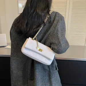 White quilted chain shoulder bag for women, elegant commuter underarm handbag with flap lock.