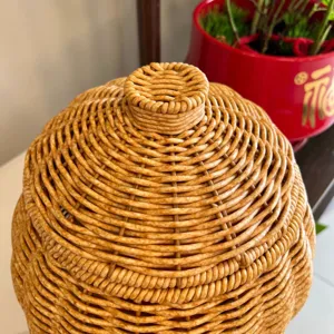 Close-up detail shot showing the exquisite handmade imitation rattan woven basket lid texture.