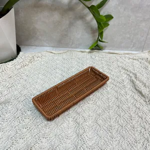 Detail shot of brown imitation rattan cutlery storage basket, ideal for kitchen tableware.