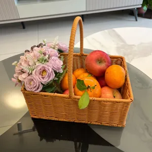 Close-up detail of a woven rectangular storage basket filled with floral arrangement and fruits.