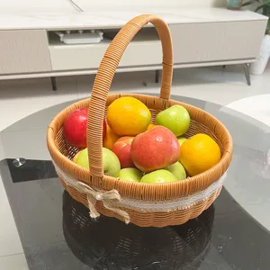Woven rattan fruit storage basket detail with handle and cute bow in a home living room.