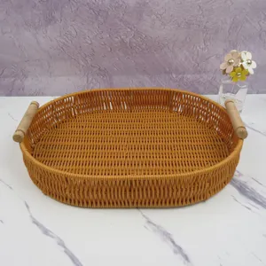 Woven storage basket with wooden handles oval rattan basket for home organization and decor.