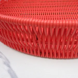 Red imitation rattan woven tray close-up detail showcasing fine texture and durable plastic material.