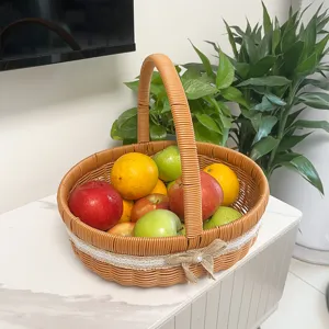 Handmade imitation rattan fruit basket with handle, perfect for kitchen and living room storage.
