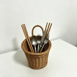 Rattan hanging storage basket for kitchen, woven organizer for utensils and small items.