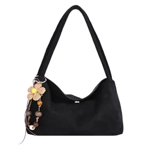 Stylish black shoulder bag for women with cute straw flower pendant, casual daily hobo purse.