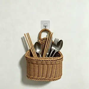 Wall-mounted woven storage basket for kitchen, imitation rattan hanging organizer for cutlery items.