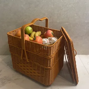 Detailed view of a large rectangular 3-layer hand-woven storage basket with lid for outdoor picnic.