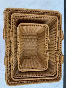 Detailed top-down view of nesting woven imitation rattan storage baskets, neat organizer set.
