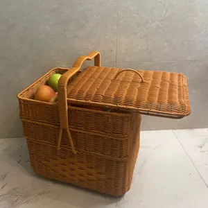 Details of the 3-tier woven wicker picnic basket with lid and handle for outdoor storage.