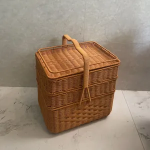Hand-woven rectangular 3-layer storage basket with lid and handle for outdoor picnic.