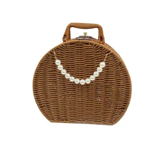 Round woven rattan handbag vintage storage box with pearl chain cosmetic case retro gift box.