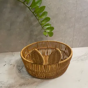Detail shot of imitation rattan woven storage basket for snacks, fruits, and home decor display.