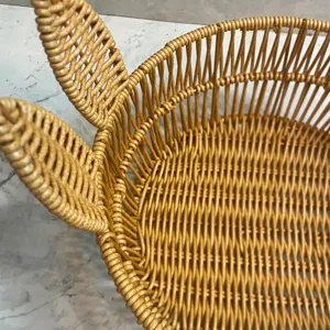 Close-up of woven rabbit ear storage basket detail showcasing fine texture and natural rattan color.