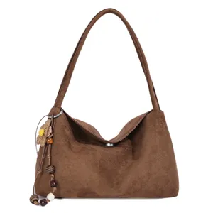 Brown suede shoulder bag for women, stylish underarm tote with wooden bead pendant charm.