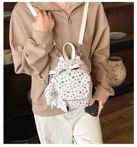 Joli mini sac à dos imprimé étoiles pour femme, sac décontracté élégant au quotidien.