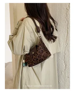 Close-up detail shot of the retro faux suede leopard print shoulder bag for women.