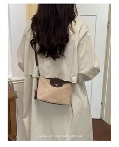 Korean retro suede shoulder bag for women, simple commuter crossbody handbag with flap.