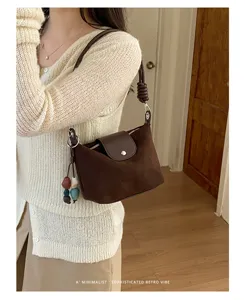 Minimalist retro suede shoulder bag for women, chic brown commuter hobo bag with chic knot strap.