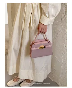 Detailed view of women casual solid color top handle small square bag retro shoulder bag