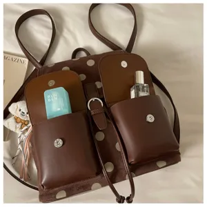 Korean style brown polka dot backpack detail showing large capacity and dual front pockets.