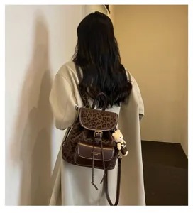 Korean style casual women backpack with leopard print leather design and cute bear pendant.