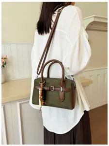 Retro green Boston handbag for women, chic suede and leather patchwork crossbody shoulder bag.