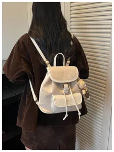 Detailed back view of women casual white backpack with leopard flap and cute bear pendant.