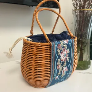Handmade rattan woven handbag with floral embroidered blue fabric panel, daily casual tote bag